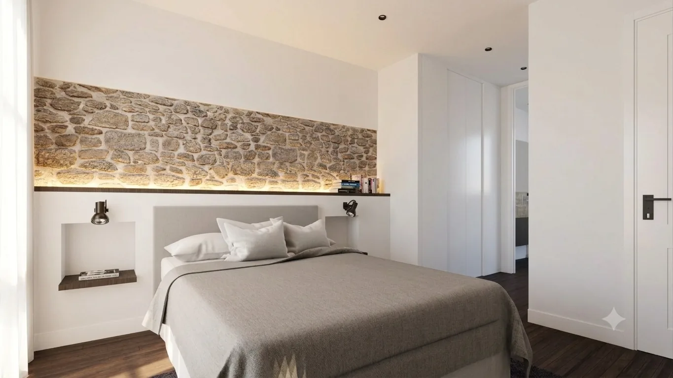 Dormitorio luminoso con pared de piedra vista y tonos neutros